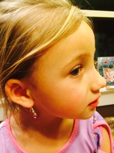 My youngest with her big girl dangle earrings from a boy. Definitely a traumatic experience. Parenting defeat on Friday the 13th.
